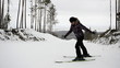 Woman jumps to ski on the mountain top