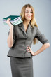 Business woman with with pile of books
