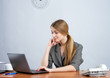 Young female executive working on laptop