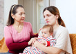 woman gives solace to sad adult daughter