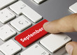 September calendar keyboard key finger