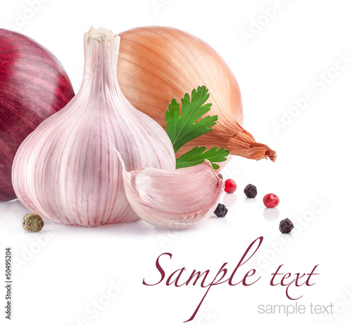 Photo: Garlic and onion with peppercorn and parsley isolated on white Garlic and onion with peppercorn and parsley isolated on white