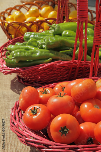 Photo: vegetablesand fruits in baskets on farmers market vegetablesand fruits in baskets on farmers market