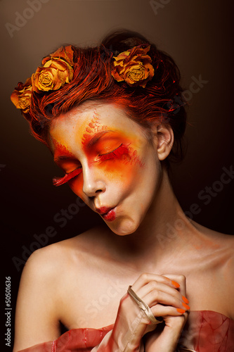 Photo: Grimace. Funny Woman with Flowers having fun. Theatrical Style Grimace. Funny Woman with Flowers having fun. Theatrical Style