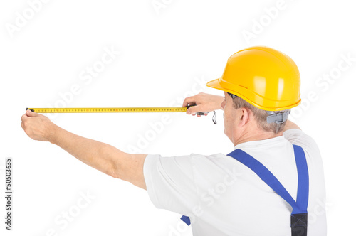 Photo: worker with measuring tape worker with measuring tape