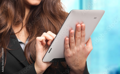 Photo: Young businesswoman using a tablet Young businesswoman using a tablet