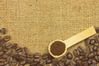 Coffee ground in spoon on coffee seeds