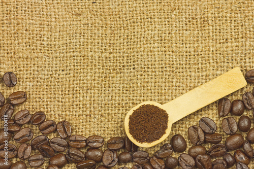 Photo: Coffee ground in spoon on coffee seeds Coffee ground in spoon on coffee seeds