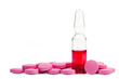 Red ampule and pink pills