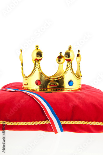 Photo: Golden crown on velvet pillow with Dutch flag Golden crown on velvet pillow with Dutch flag