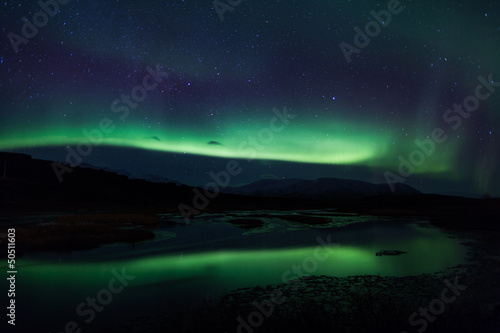 Photo: Northern lights above lagoon in Iceland Northern lights above lagoon in Iceland