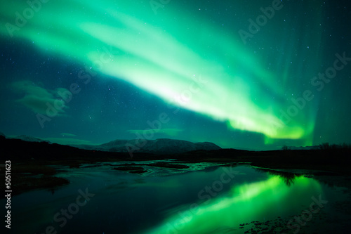 Photo: Northern lights above lagoon in Iceland Northern lights above lagoon in Iceland