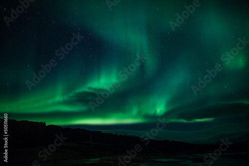 Photo: Northern lights above lagoon in Iceland Northern lights above lagoon in Iceland