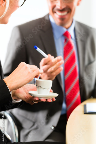 Photo: businesspeople in business office drink coffee businesspeople in business office drink coffee