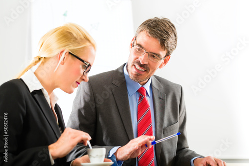 Photo: businesspeople in business office drink coffee businesspeople in business office drink coffee