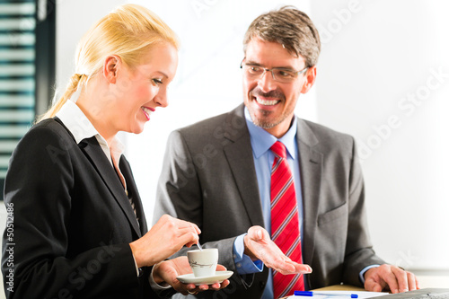 Photo: businesspeople in business office drink coffee businesspeople in business office drink coffee