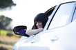 .Woman driving her new car