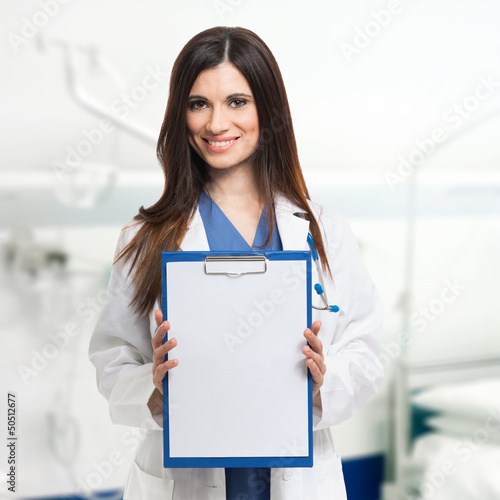 Photo: Doctor showing a sheet of paper Doctor showing a sheet of paper