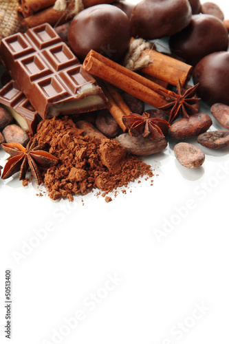 Photo: Composition of chocolate sweets, cocoa and spices, isolated Composition of chocolate sweets, cocoa and spices, isolated