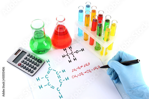 Photo: Hand scientist writing formulas isolated on white Hand scientist writing formulas isolated on white