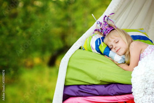 Photo: the princess sleeps on a bed. fairy tale "the princess on a pea the princess sleeps on a bed. fairy tale "the princess on a pea