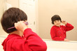 Girl looks at herself in the mirror