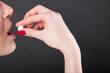 Woman taking pill