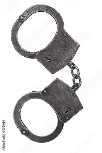 Photo: Metal handcuffs for hands on a white background Metal handcuffs for hands on a white background