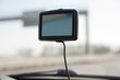 Car navigation system on front window in car.