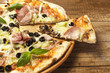 close up of tasty pizza on wooden background
