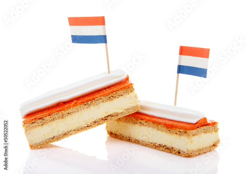 Photo: Traditional Dutch pastry called tompouce with flags Traditional Dutch pastry called tompouce with flags
