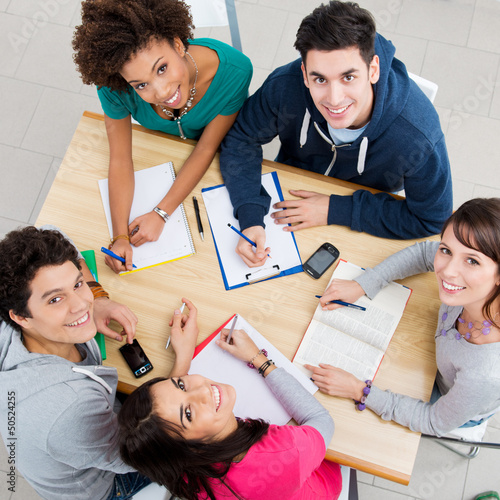 Photo: Happy Friends Studying Together Happy Friends Studying Together