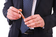 Business man holding a pen.