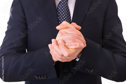 Photo: Businessman rubbing his hands together. Businessman rubbing his hands together.