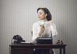 Business woman drying her hair in office