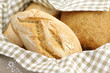 Fresh Italian durum wheat bread in a basket with napkin