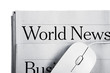Photo: Online News -Computer mouse and Newspaper Online News -Computer mouse and Newspaper