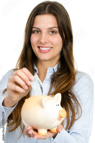 Photo: mädchen beim geld sparen mädchen beim geld sparen