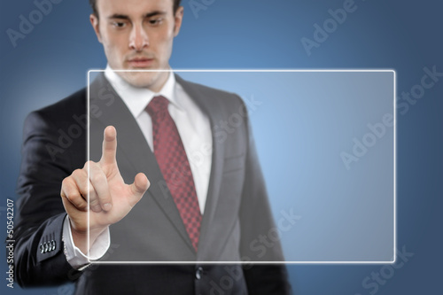Photo: Man touching blank display Man touching blank display