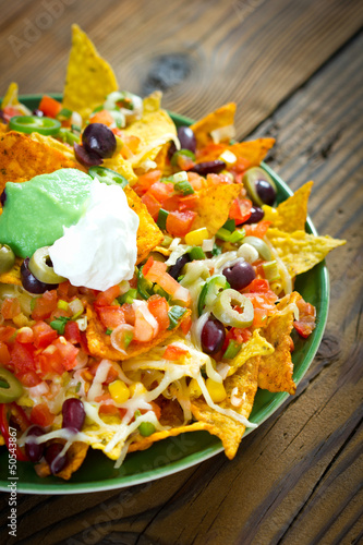 Photo: Nachos on the wooden table Nachos on the wooden table