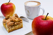 Coffee, apple pie and two apples