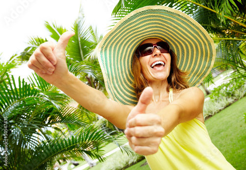 Photo: Woman in the tropical garden. Woman in the tropical garden.