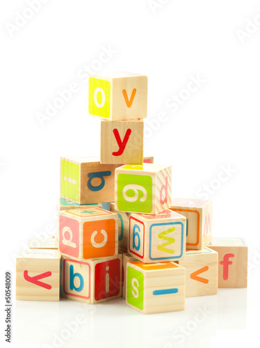 Photo: wooden toy cubes with letters. Wooden alphabet blocks. wooden toy cubes with letters. Wooden alphabet blocks.