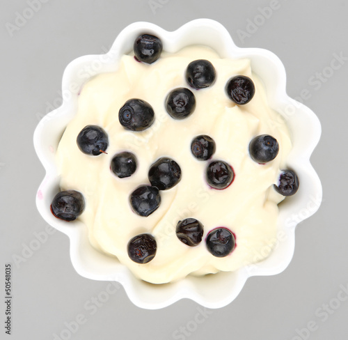 Photo: blueberries cream in a white bowl blueberries cream in a white bowl