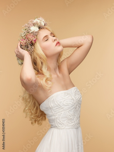 Photo: woman wearing wreath of flowers woman wearing wreath of flowers