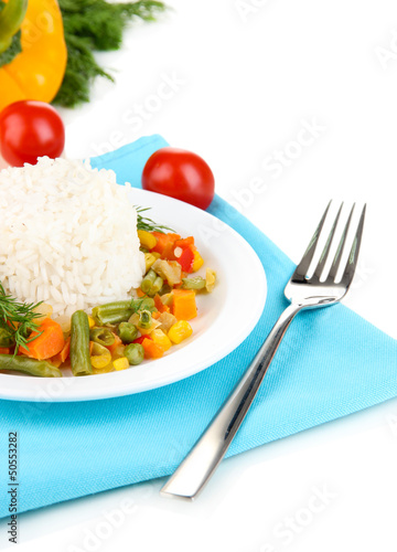Photo: Delicious risotto with vegetables isolated on white Delicious risotto with vegetables isolated on white