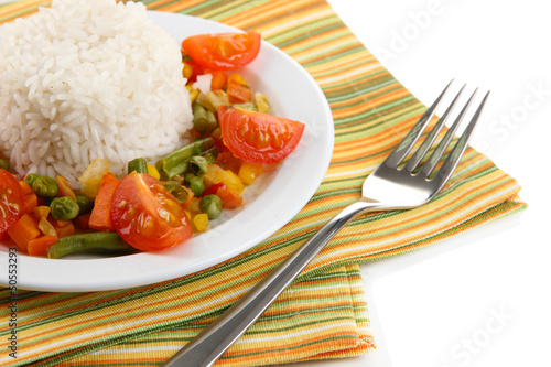 Photo: Delicious risotto with vegetables isolated on white Delicious risotto with vegetables isolated on white