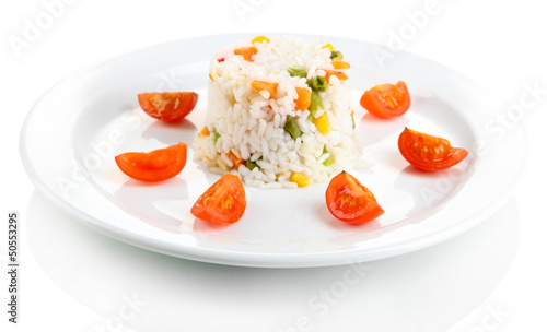 Photo: Delicious risotto with vegetables, isolated on white Delicious risotto with vegetables, isolated on white