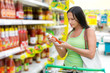 A woman buys ketchup