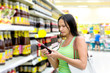 woman buys sunflower soy sauce